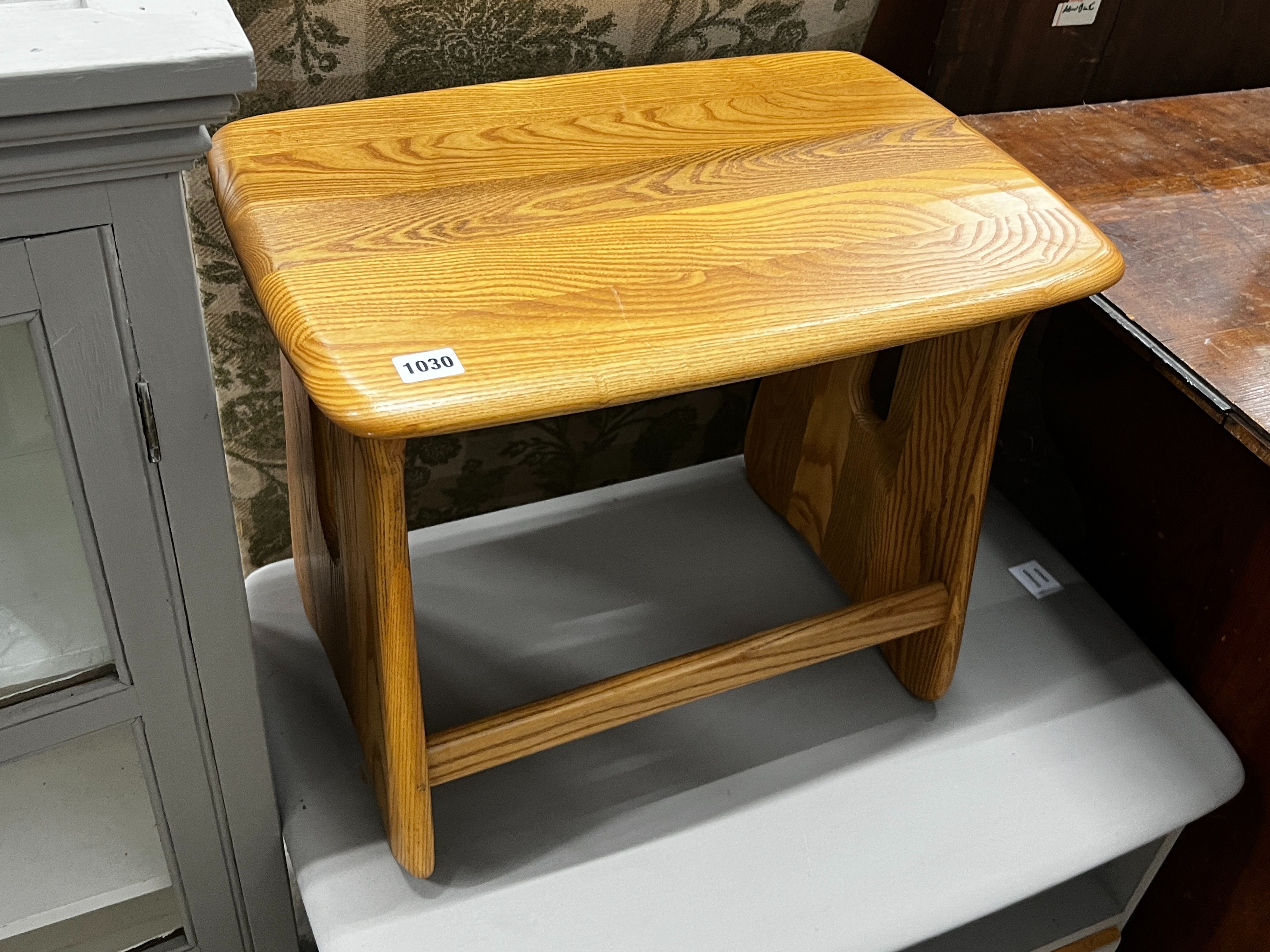 An Ercol rectangular elm occasional table, width 51cm, height 42cm together with an Ercol television stand, later painted